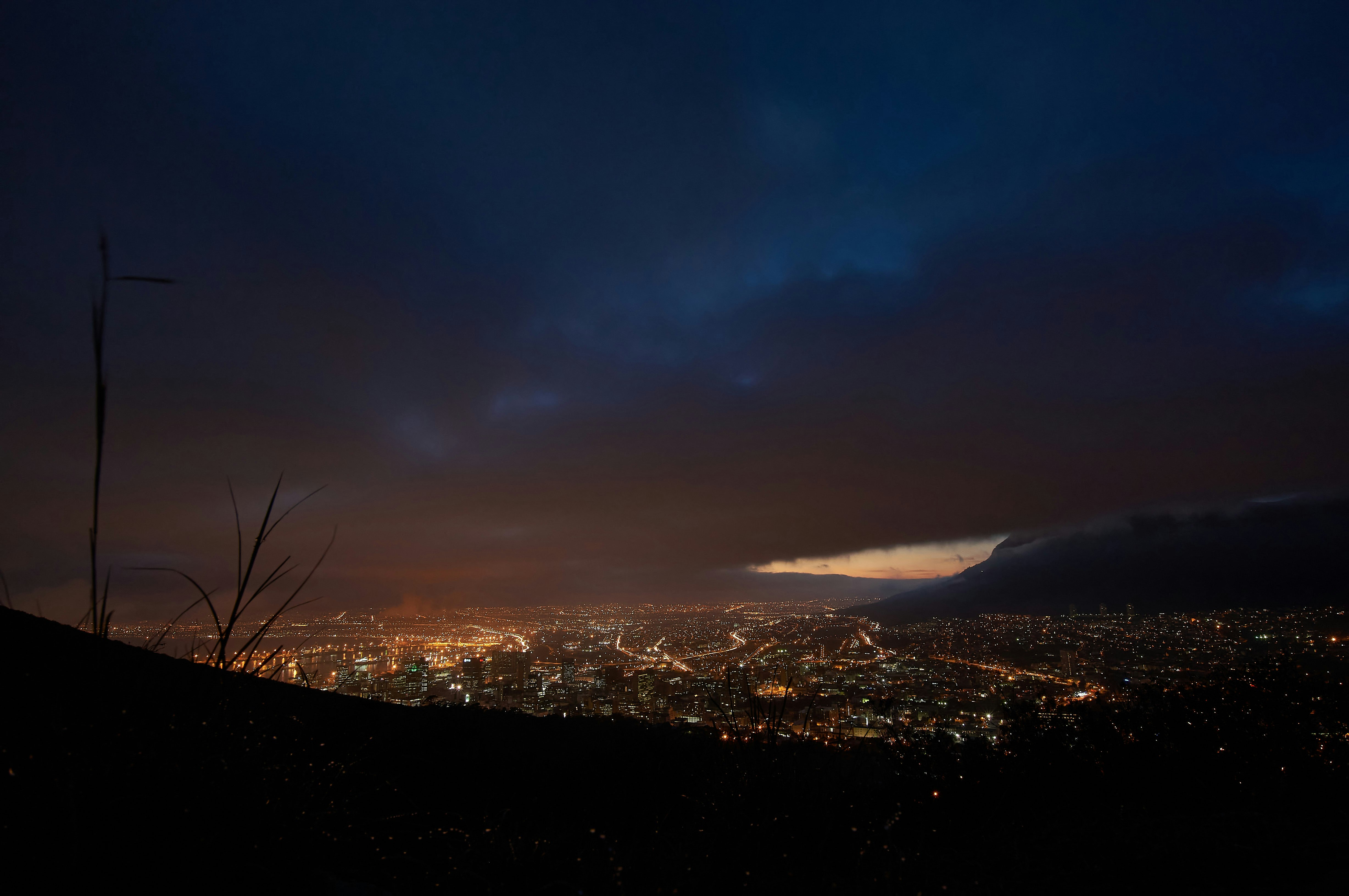 city lights turned on during night time